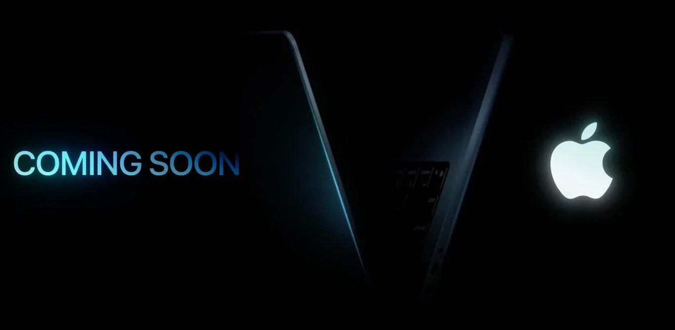 MacBook Apple en fondo oscuro con mensaje Coming Soon anunciando nuevos accesorios