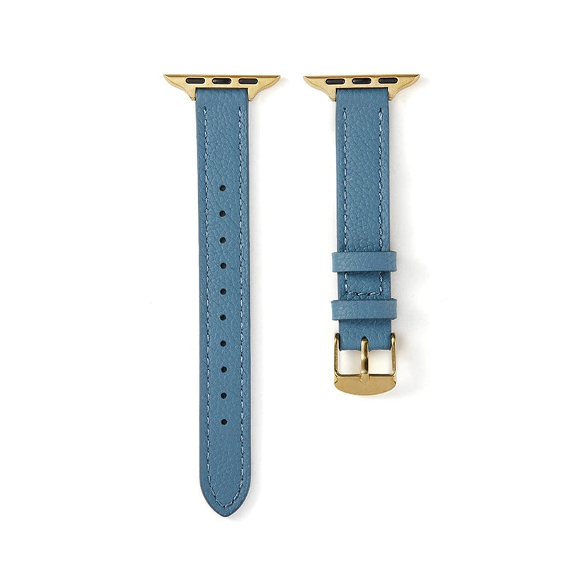 Correa fina de cuero granulado para Apple Watch en color azul denim, de la marca Vivaldo, muestra detalles de textura y cierres.