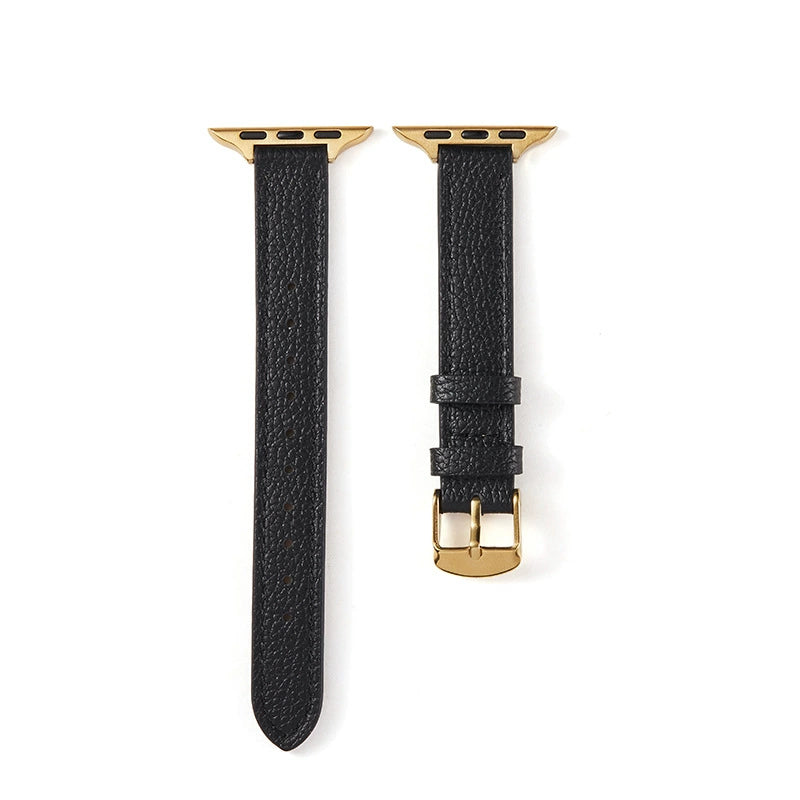 Correa fina de cuero granulado para Apple Watch en negro y dorado, de la marca Vivaldo, con acabado elegante y detalles en cuero.