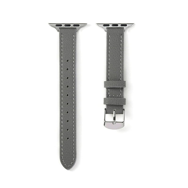 Correa fina de cuero granulado gris para Apple Watch de la marca Vivaldo, mostrando el acabado en cuero y la hebilla.